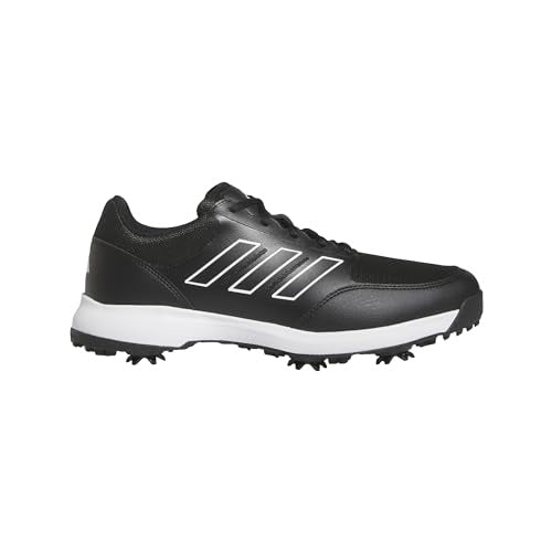Black Adidas golf shoe with white sole on a white background