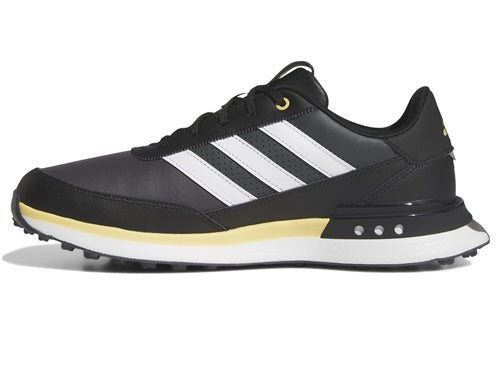 Black Adidas sneaker with white stripes on a white background