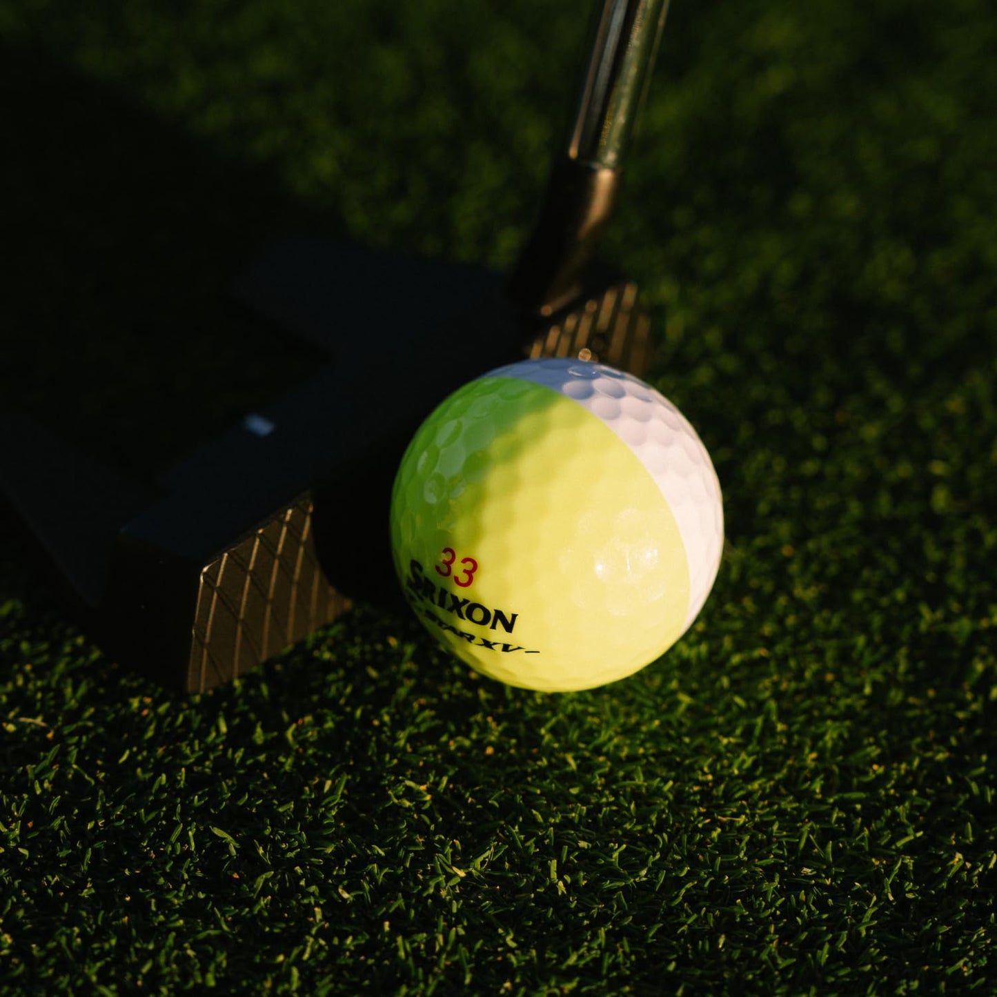 Lifestyle image of Srixon Z Star XV Divide golf balls on a putting green
