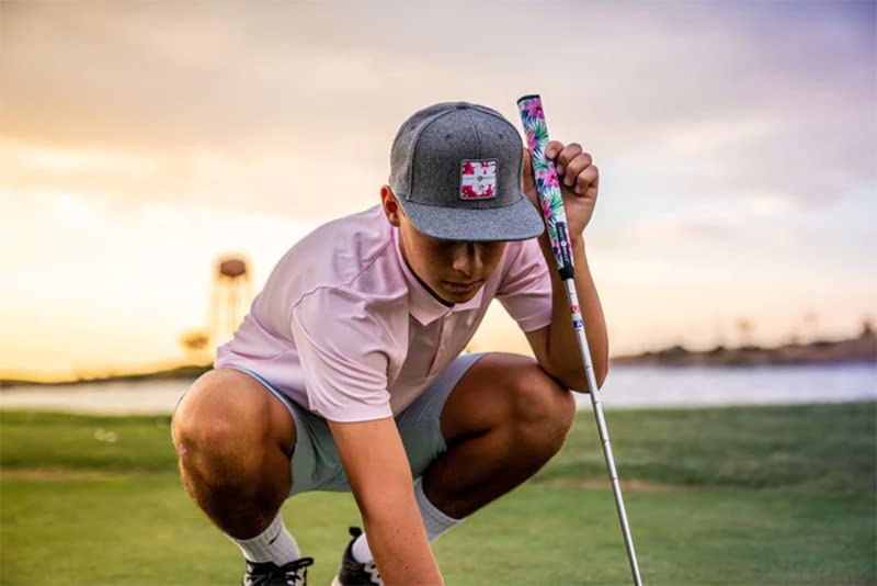 a lifestyle image of a golfer on a green with his putter and Sweetrollz putter grip in hand