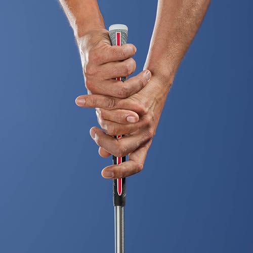 Close-up of hands gripping a golf club against a blue background