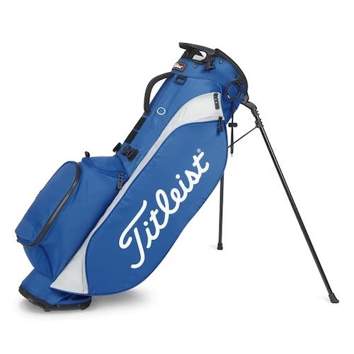 Blue and white Titleist golf bag with a stand on a white background