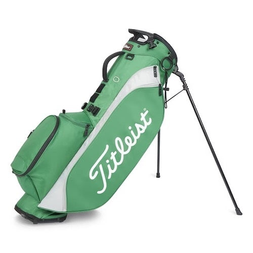 Green and white Titleist golf bag with a stand on a white background