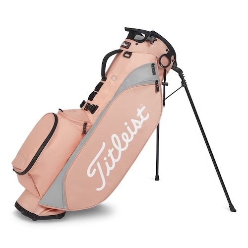 Pink golf bag with 'Titleist' branding on a white background