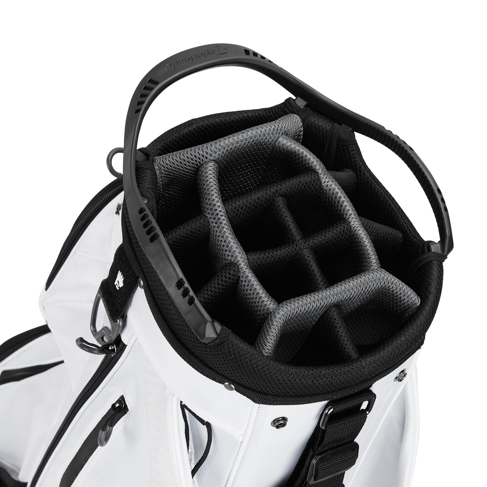 Close-up of a white golf bag with black interior and straps on a white background