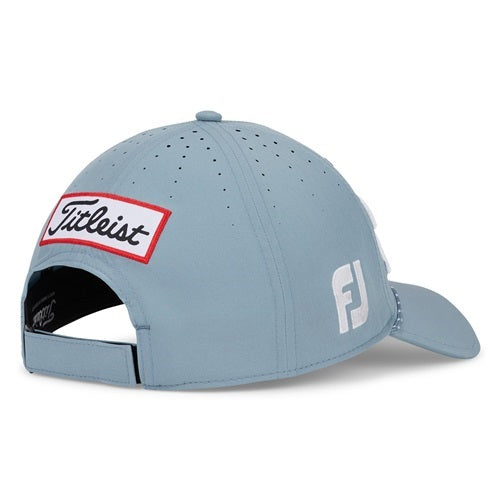 A blue Titleist hat with Titleist patch on a white background