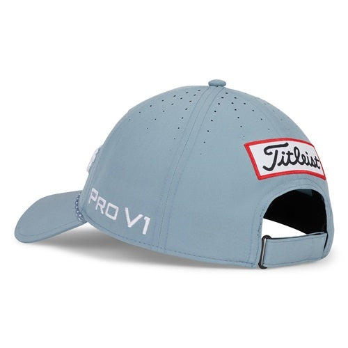 A blue Titleist hat with Titleist patch on a white background