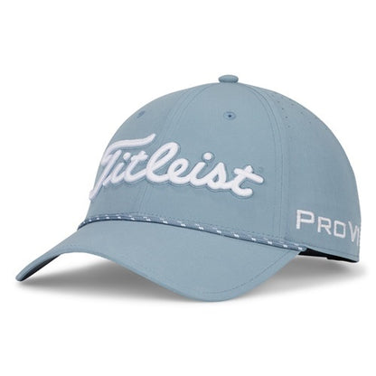 A blue Titleist hat with white stitching on a white background