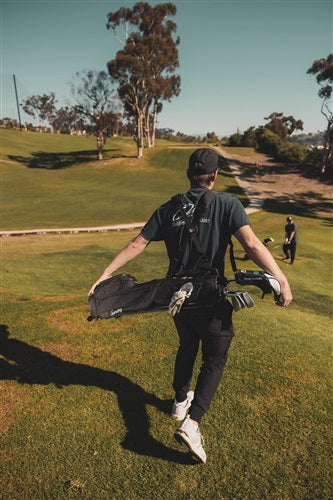 People on a golf course with Sunday Golf gear