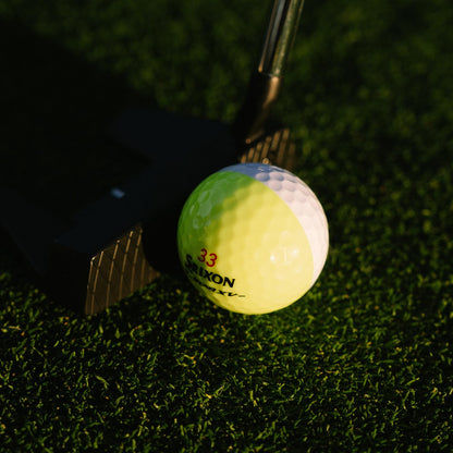 Lifestyle image of Srixon Z Star XV Divide golf balls on a putting green