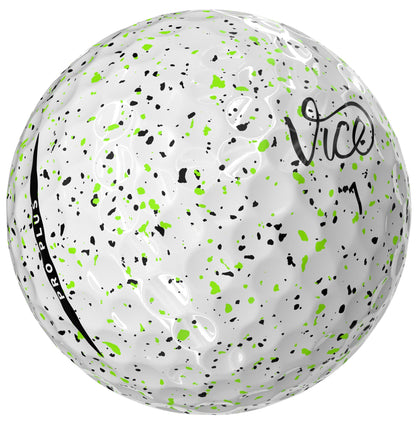 White golf ball with green and black speckles and 'Vice' branding on a white background