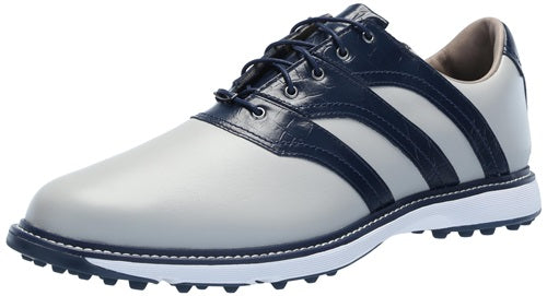 White and navy golf shoe on a white background