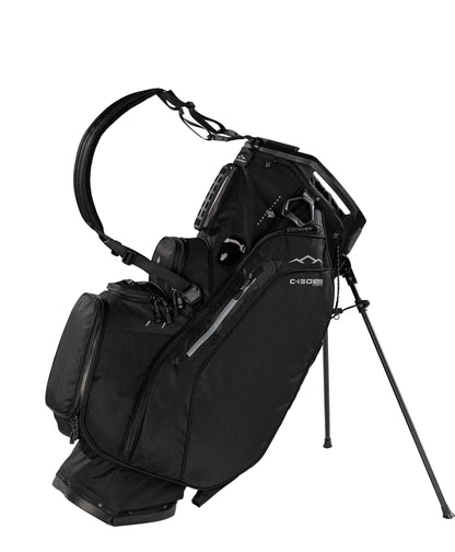 Black golf bag with stand on a white background