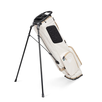 Beige golf bag with black accents on a white background