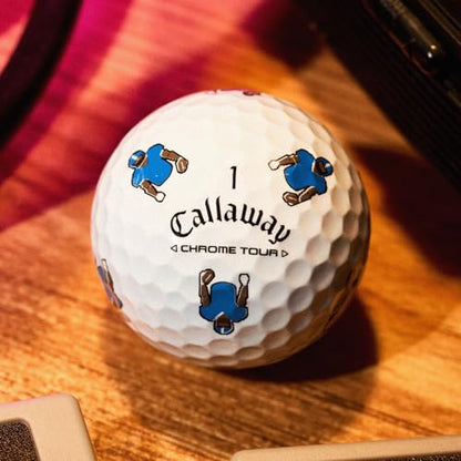 Callaway golf ball with blue and brown graphics on a wooden surface