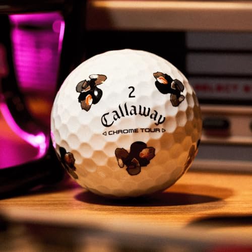 Callaway golf ball with bee designs on a wooden surface