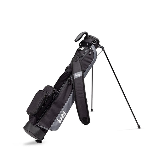 Black golf bag with stand on a white background