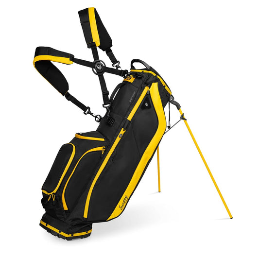 Black and yellow golf bag with stand on a white background