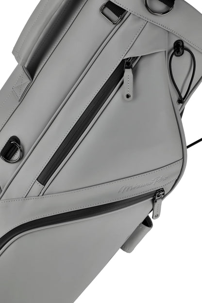 Gray golf bag with black zippers on a white background