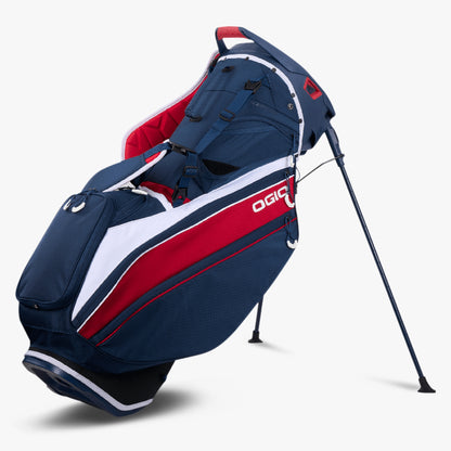 An image of a OGIO 2026 Silencer Hybrid Golf Stand Bag - Red / White / Blue on a white background