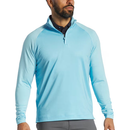 An image of aTonal Dot Block Midlayer Light Blue L on a white background