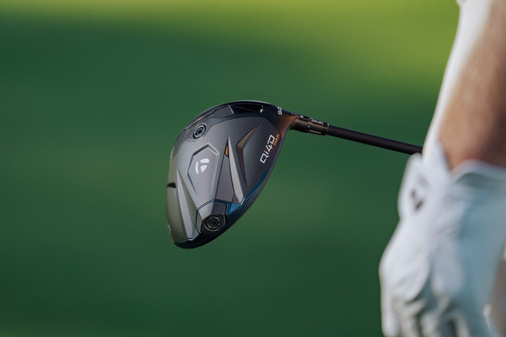 Banner image of TaylorMade Qi4D Max Driver on a green background